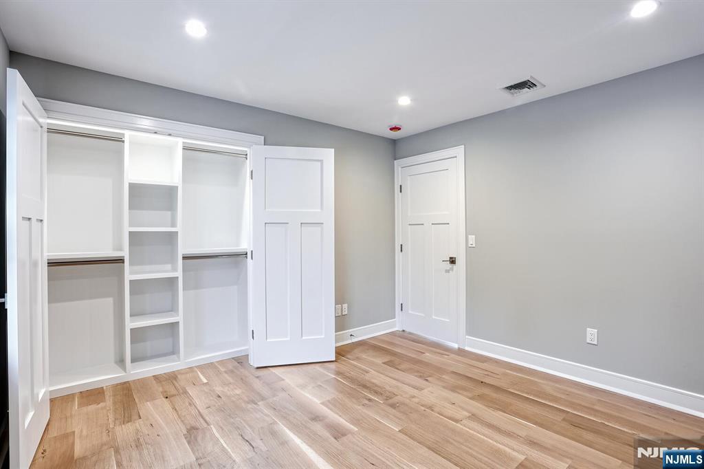 57 Mill Road Park Ridge, NJ 07656 - Photo 33 of 50 a view of an empty room with wooden floor and closet