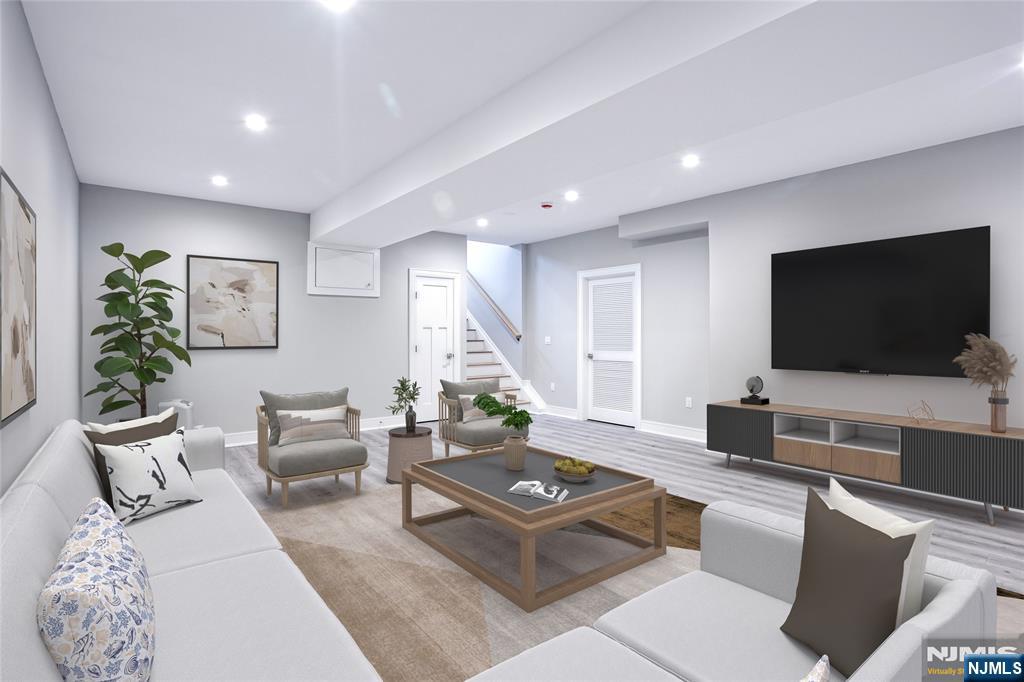 57 Mill Road Park Ridge, NJ 07656 - Photo 34 of 50 a living room with furniture and a flat screen tv