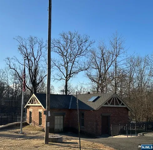 a view of a wooden deck front of house