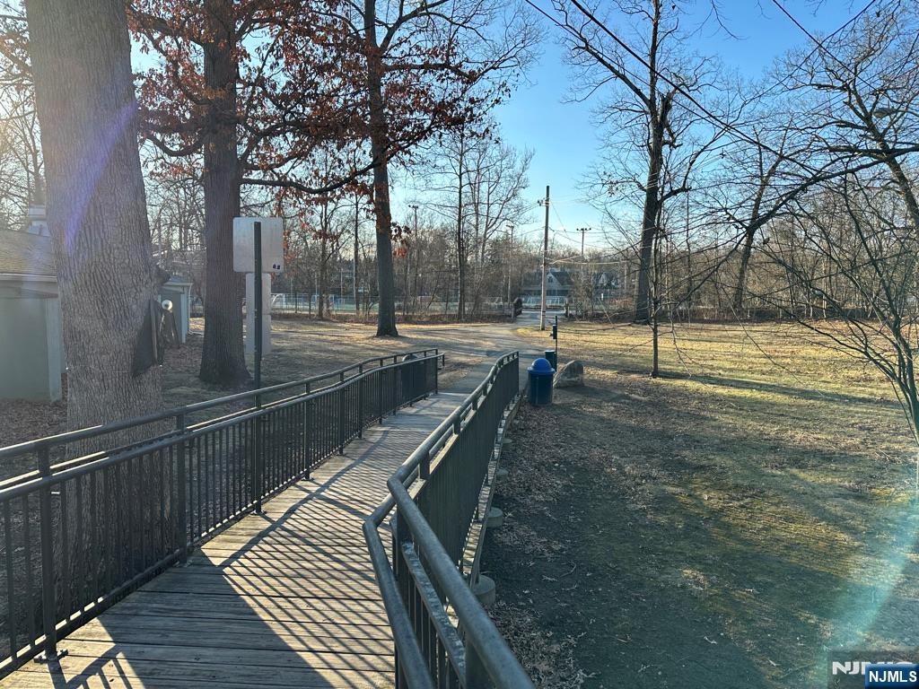 57 Mill Road Park Ridge, NJ 07656 - Photo 49 of 50 a view of a swimming pool with a patio and wooden deck
