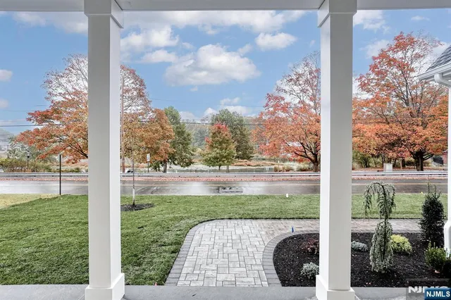 a kitchen with a sink window and cabinets