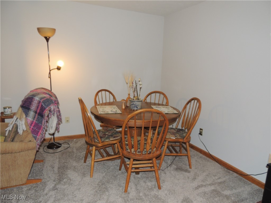 3070 Kent Road, Unit 406 Stow, OH 44224 - Photo 9 of 33 Dining area with light colored carpet and baseboards