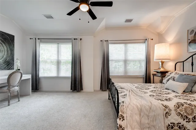 a bed room with a bed and a chair