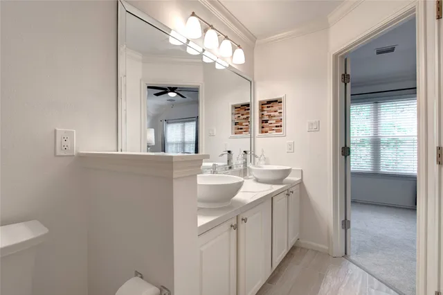 a bathroom with a sink a vanity and a mirror