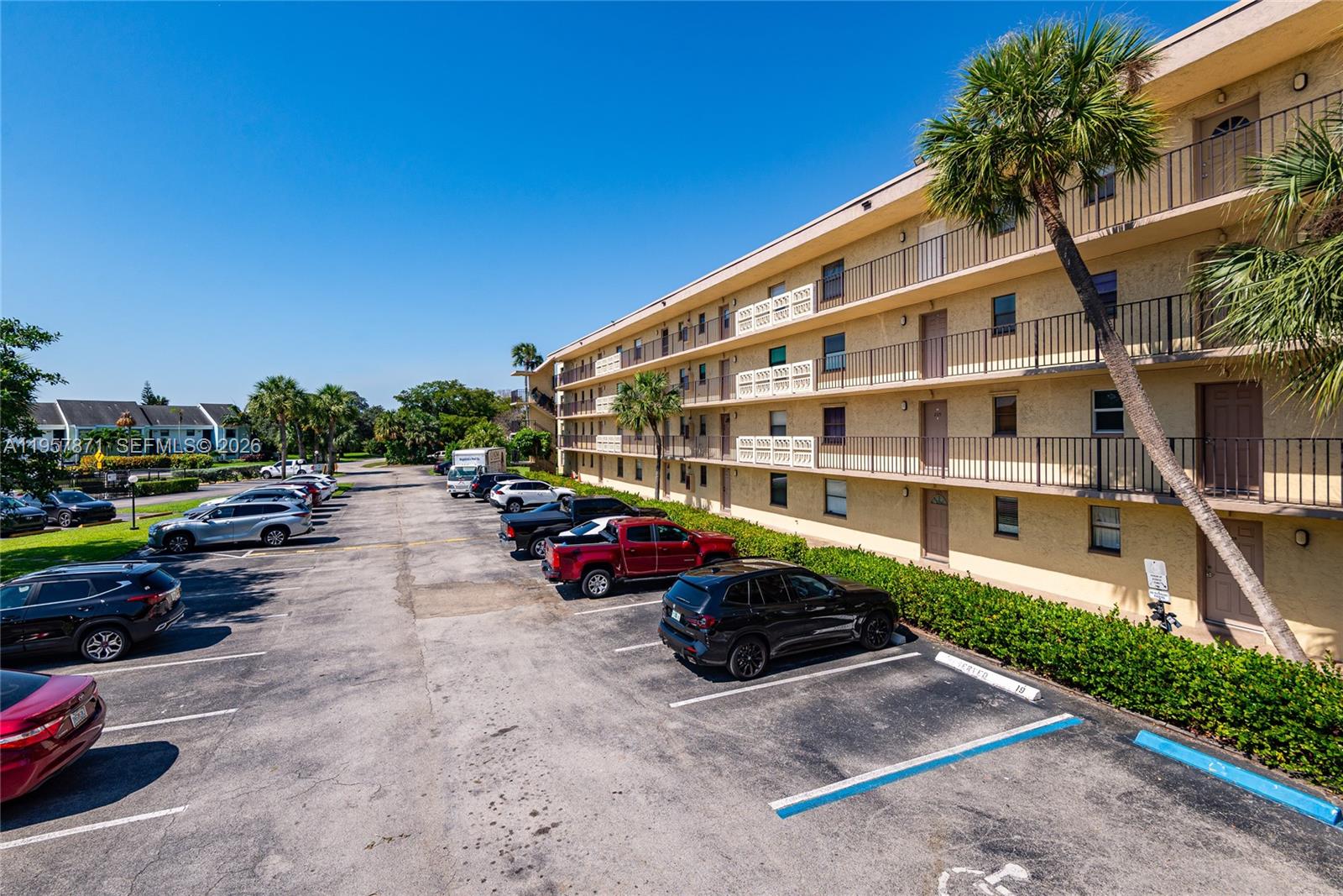 9355 Southwest 8th Street, Unit 105 Boca Raton, FL 33428 - Photo 29 of 37 a view of a street with cars
