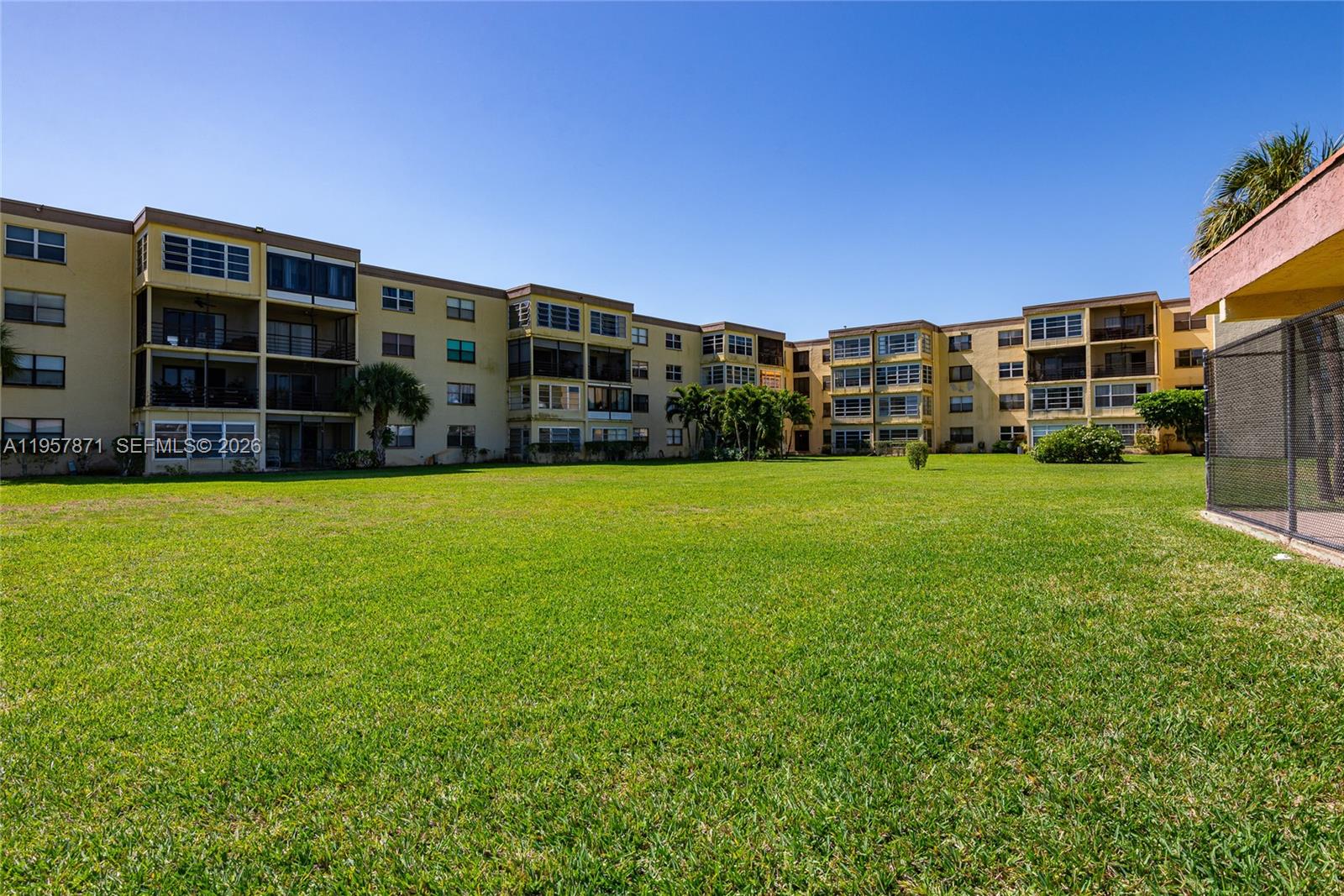 9355 Southwest 8th Street, Unit 105 Boca Raton, FL 33428 - Photo 30 of 37 a view of a house with yard and that has a big yard