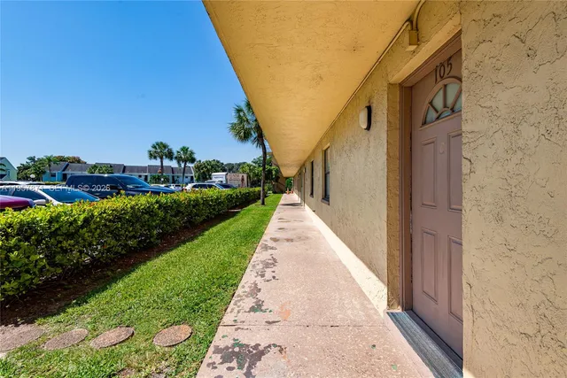a view of a swimming pool with a yard