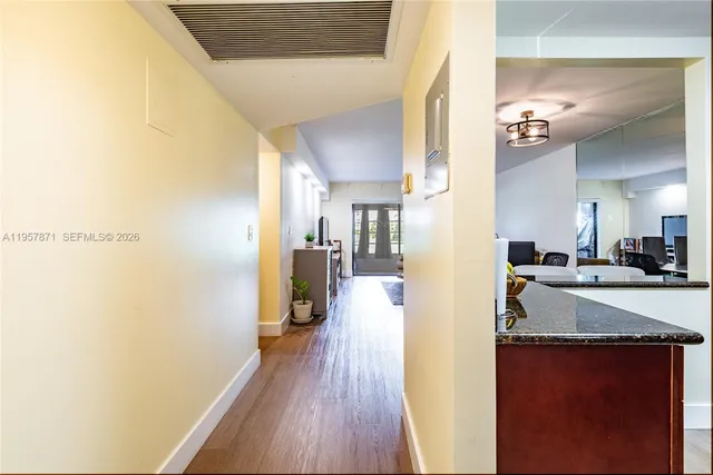 a view of a kitchen from the hallway