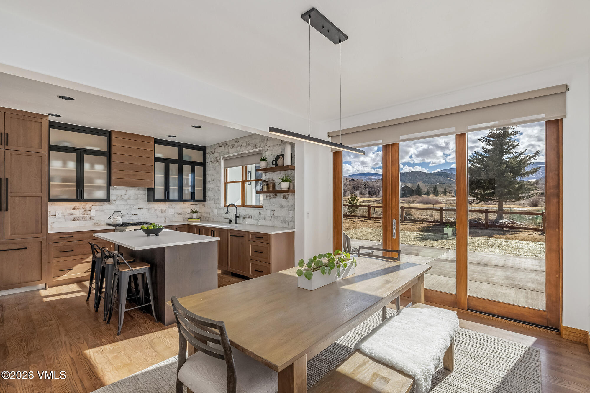 2044 Eagle Ranch Road Eagle, CO 81631 - Photo 5 of 39 a view of a dining room with furniture window and wooden floor