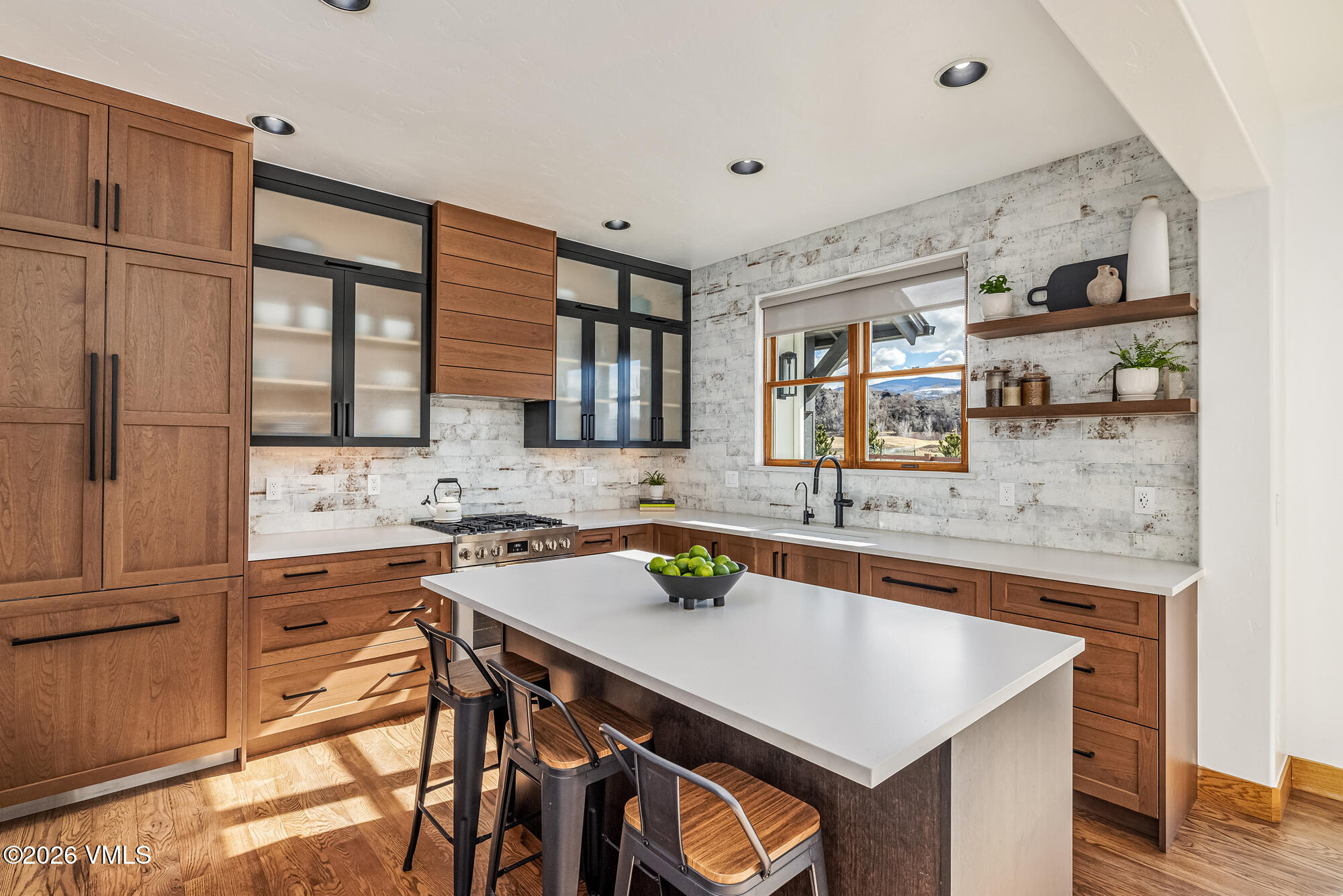 2044 Eagle Ranch Road Eagle, CO 81631 - Photo 6 of 39 a kitchen with a stove a sink and a refrigerator