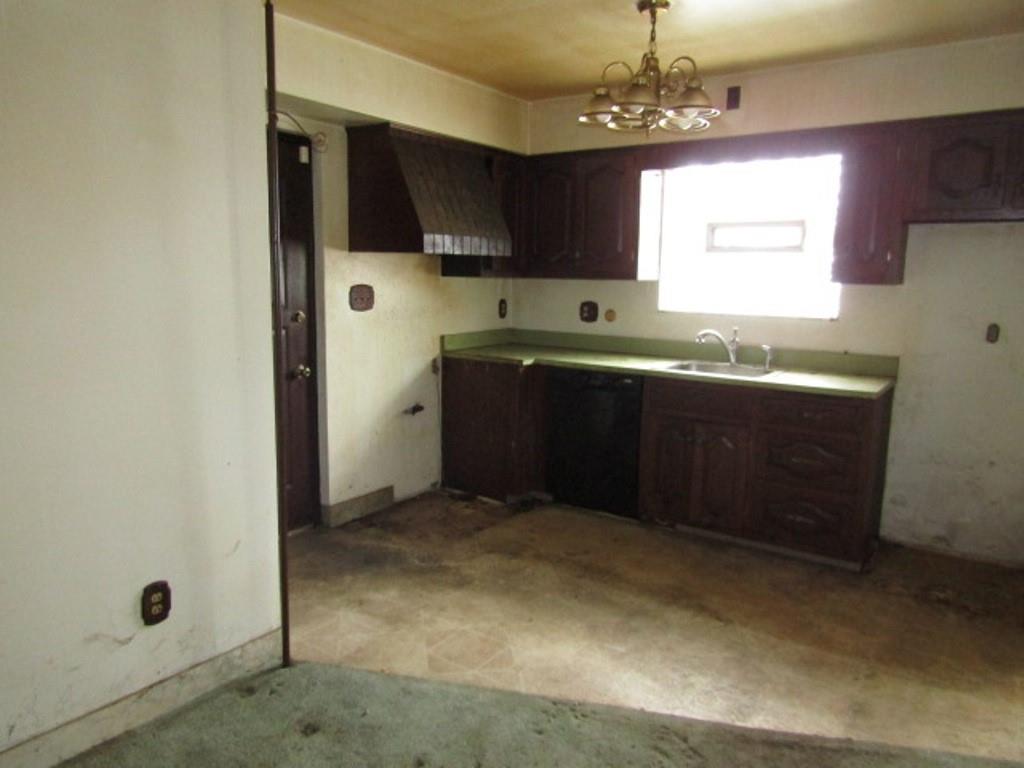 219 Camp Avenue Braddock, PA 15104 - Photo 16 of 27 a large kitchen with stainless steel appliances granite countertop a sink and cabinets