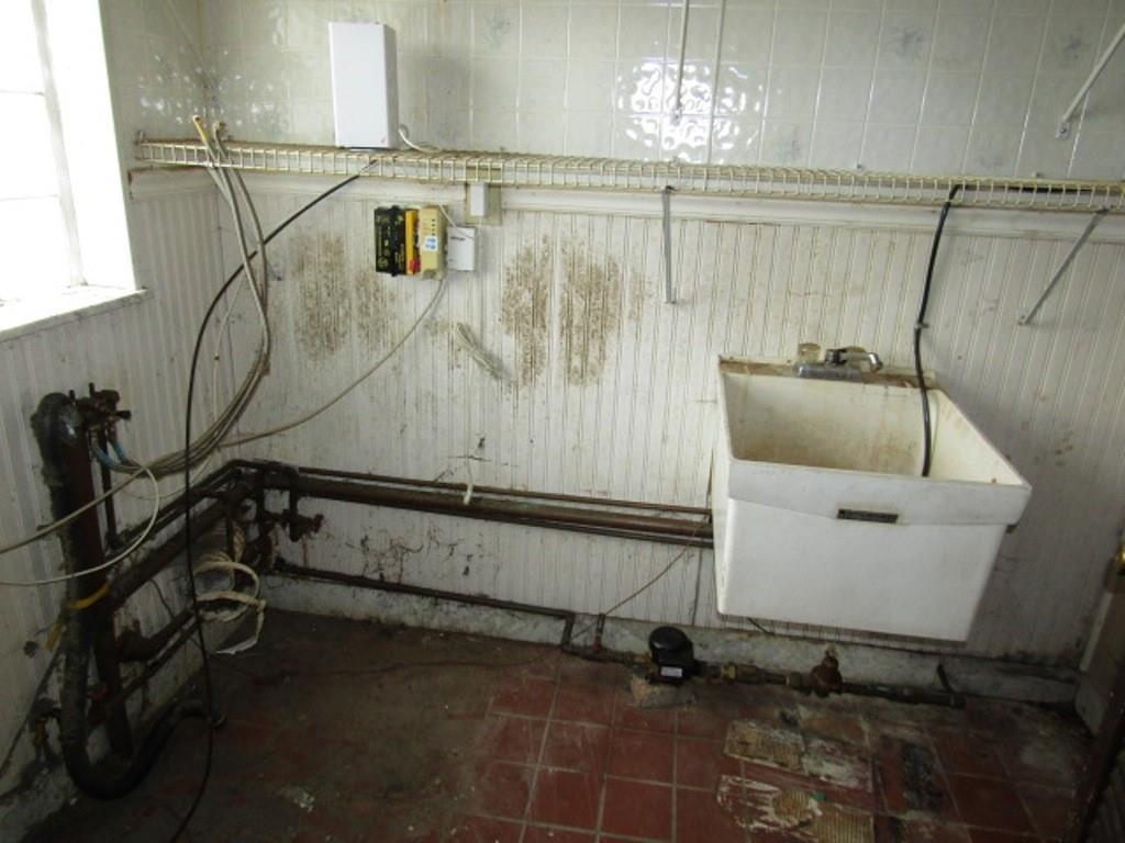 219 Camp Avenue Braddock, PA 15104 - Photo 17 of 27 a bathroom with a sink and shower