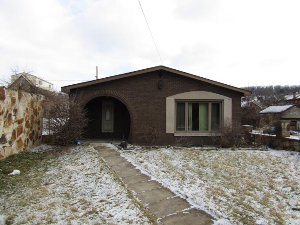 219 Camp Avenue Braddock, PA 15104 - Photo 2 of 27 a front view of a house with a yard