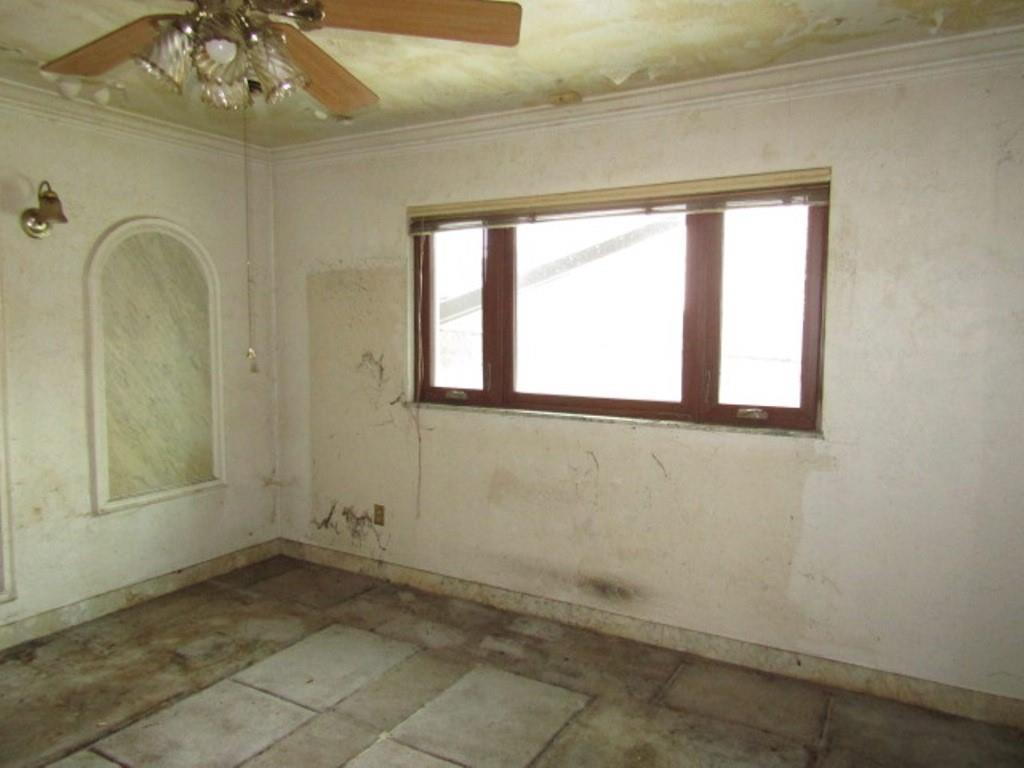 219 Camp Avenue Braddock, PA 15104 - Photo 25 of 27 a view of a room that has a window and chandelier fan