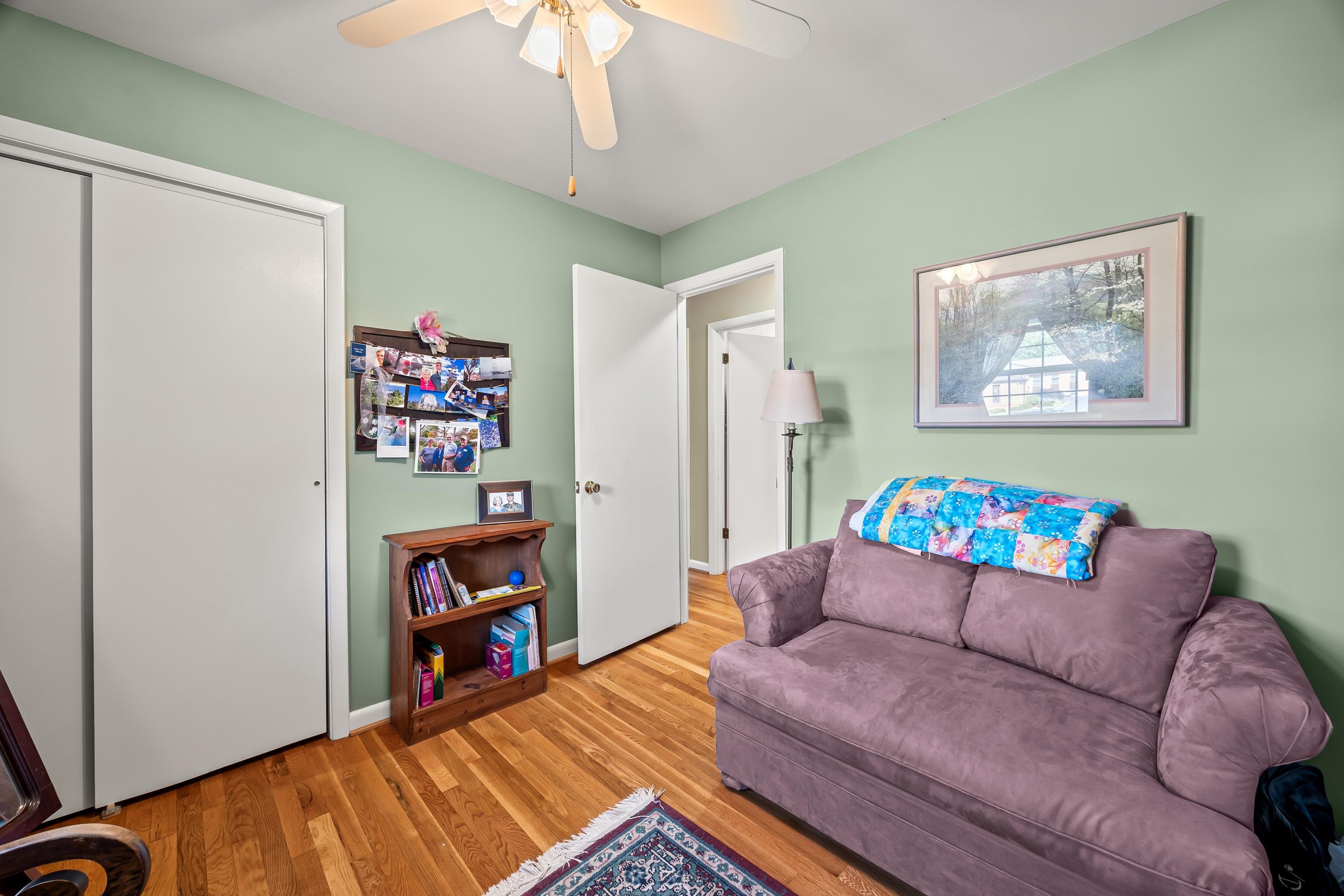 208 Tuxedo Road Staunton, VA 24401 - Photo 30 of 46 a living room with furniture and a book shelf