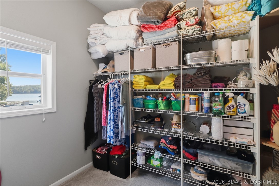 1492 Purvis Road Sunrise Beach, MO 65079 - Photo 15 of 41 Primary walk-in closet with an abundance of space