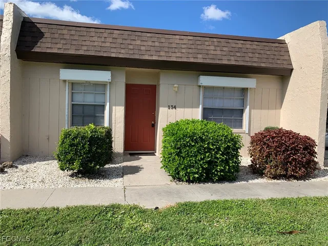 a view of a swimming pool with an outdoor space and seating area