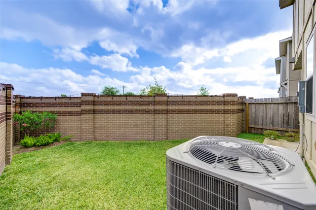 a view of a backyard with a fountain