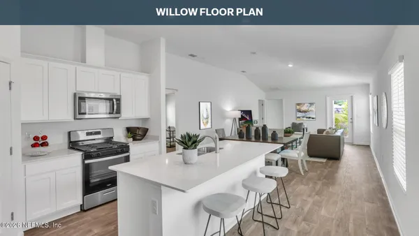 a kitchen with a table and chairs in it