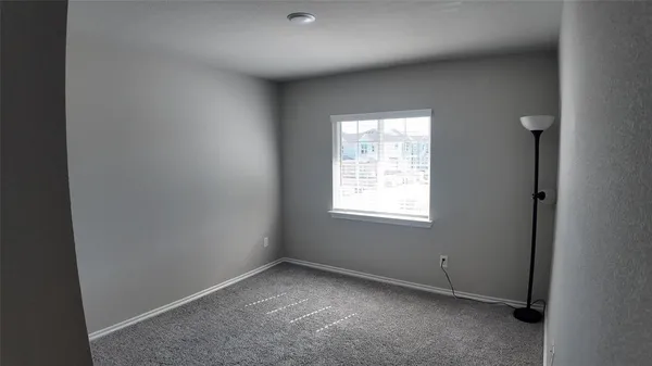 an empty room with closet area