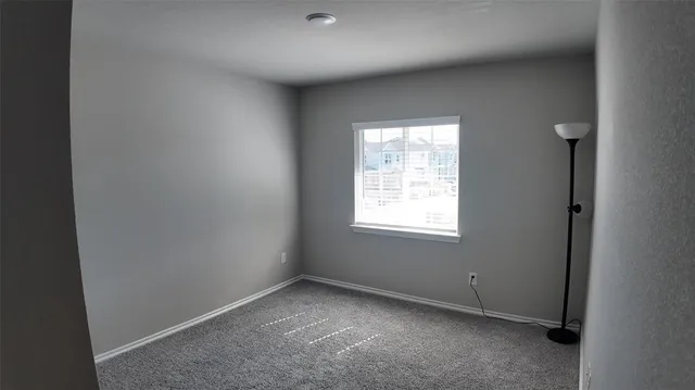 an empty room with closet area