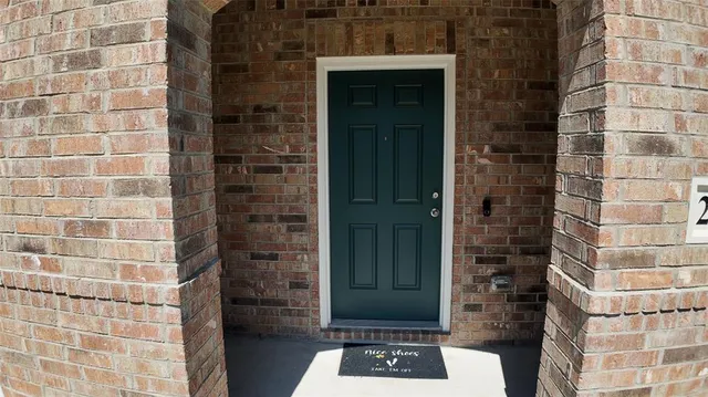 a bathroom with a shower and a sink