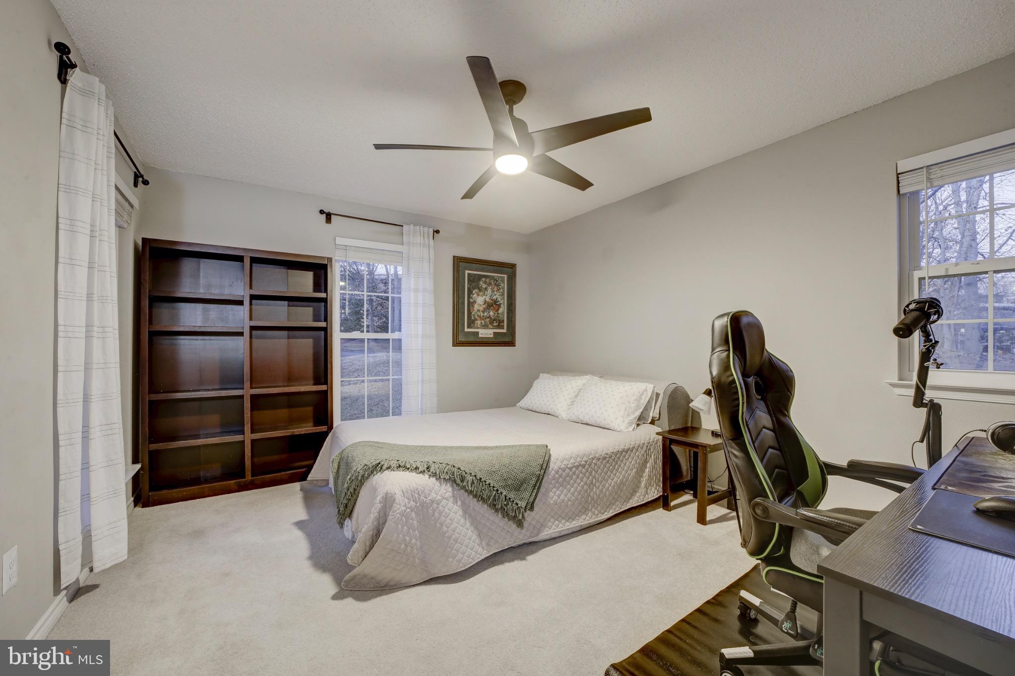 1501 Lincoln Way, Unit 101 McLean, VA 22102 - Photo 13 of 23 a bedroom with a bed and a desk