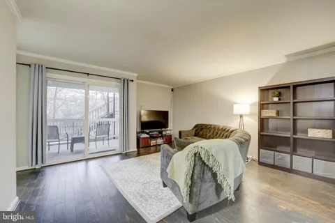 a bedroom with furniture and a flat screen tv