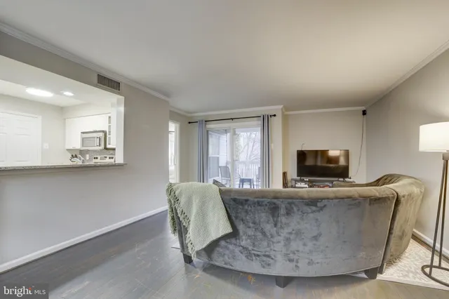 a living room with fireplace furniture and a flat screen tv