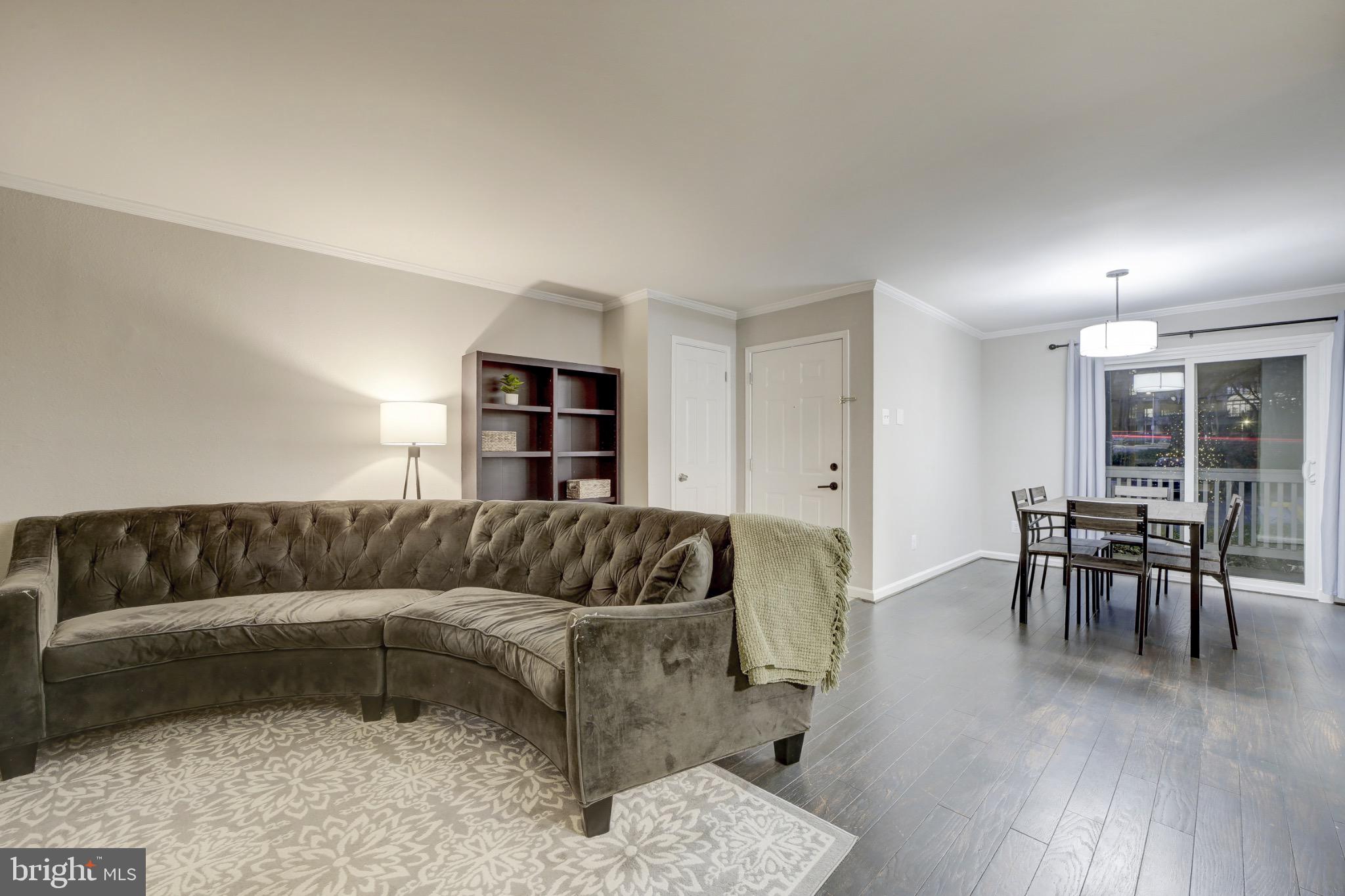 1501 Lincoln Way, Unit 101 McLean, VA 22102 - Photo 22 of 23 a living room with furniture and a wooden floor