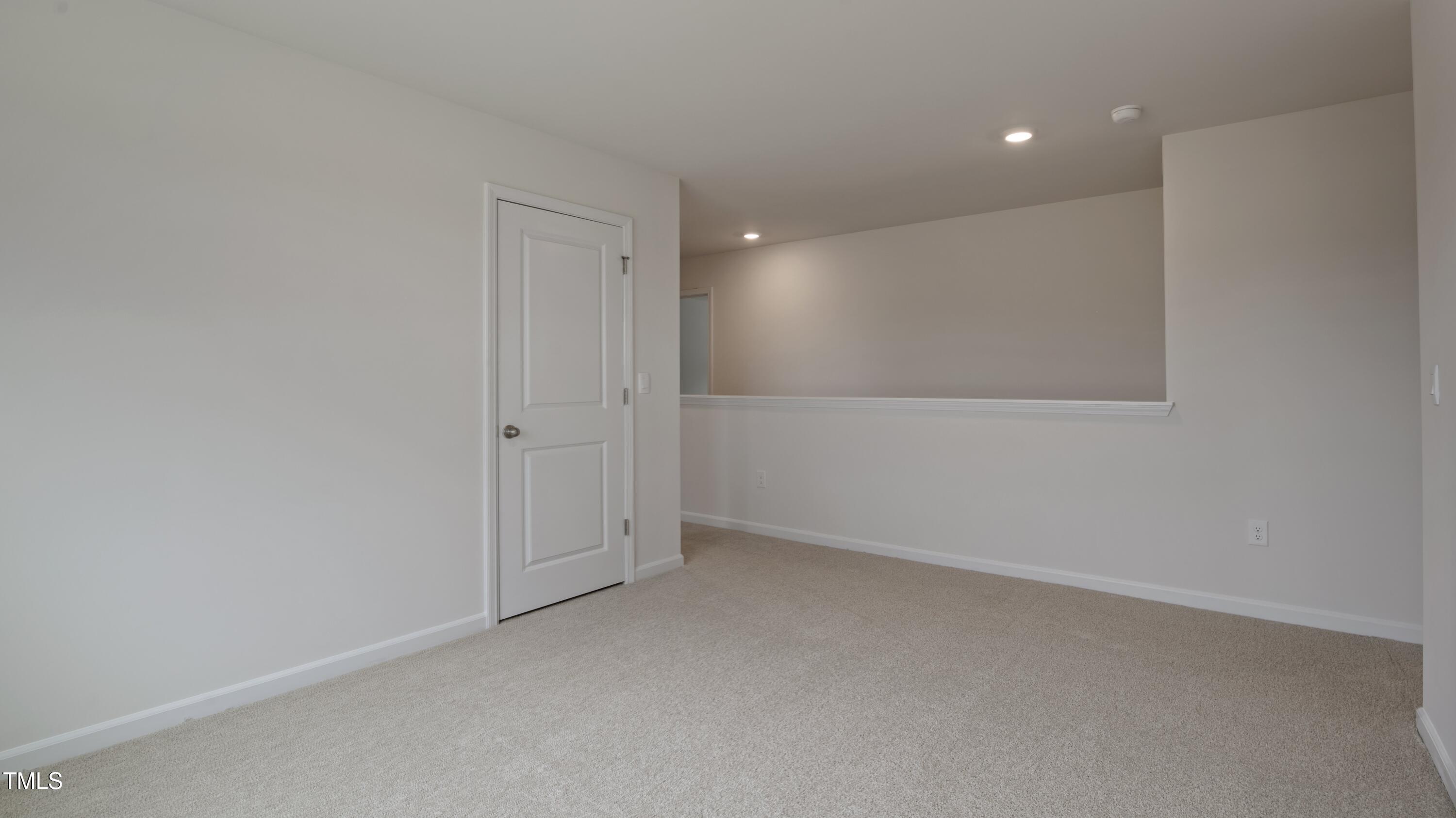 845 Comice Pear Way Willow Spring, NC 27592 - Photo 15 of 36 an empty room with a empty space and windows