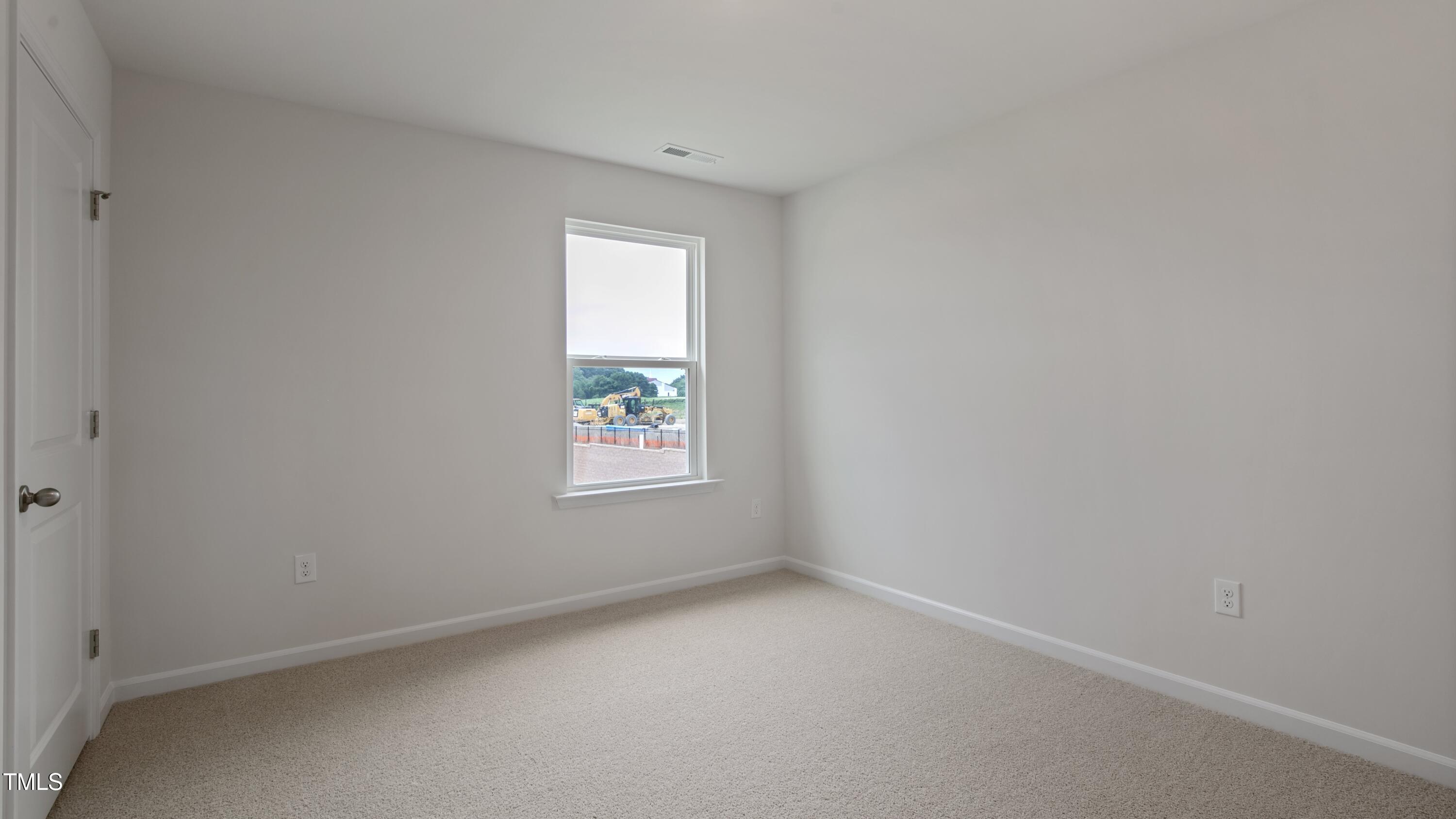 845 Comice Pear Way Willow Spring, NC 27592 - Photo 16 of 36 an empty room with a window