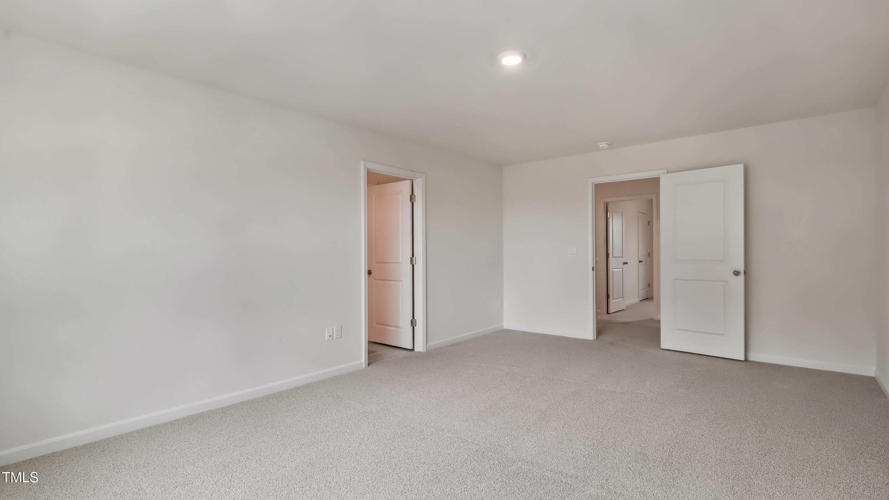 845 Comice Pear Way Willow Spring, NC 27592 - Photo 20 of 36 a view of an empty room and closet area