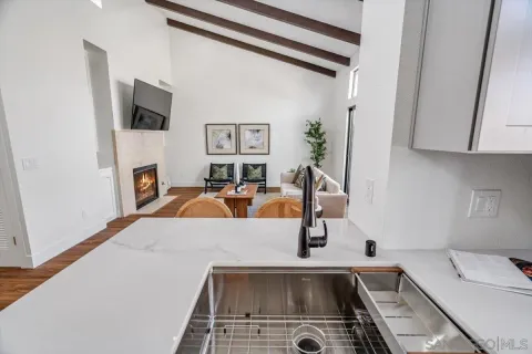 a kitchen with a refrigerator and a sink