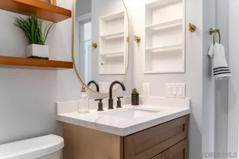 a bathroom with a sink and a toilet