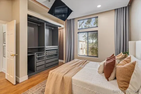 a bedroom with a bed and a window