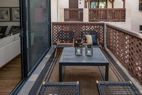 a view of a balcony with chairs
