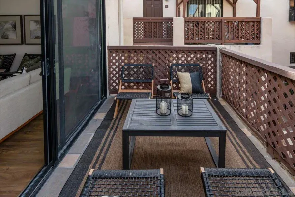 a view of a balcony with chairs