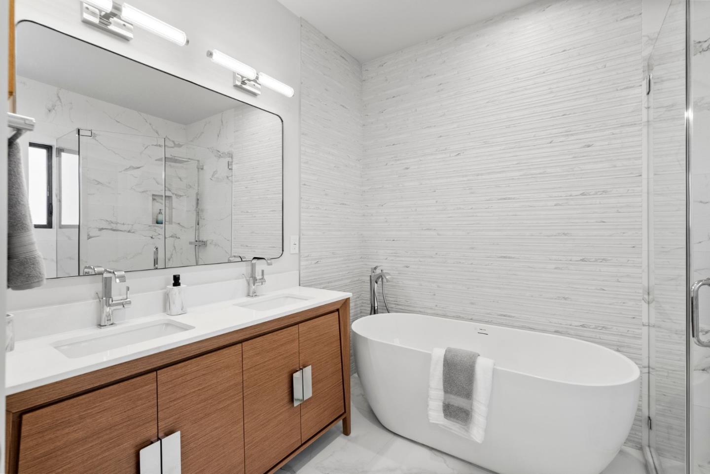 829 Sutter Avenue Sunnyvale, CA 94086 - Photo 15 of 36 a bathroom with a double vanity sink mirror and bathtub