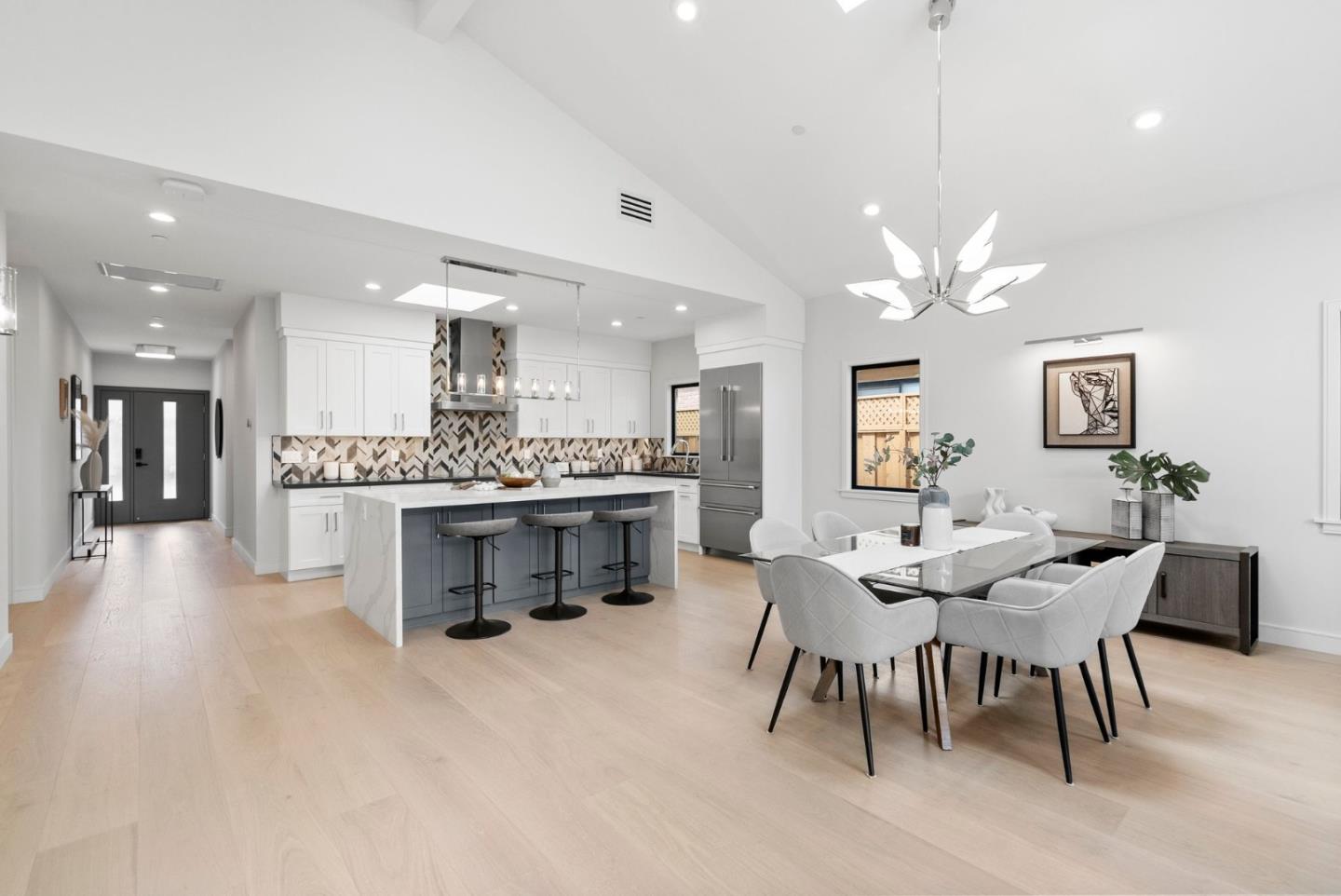 829 Sutter Avenue Sunnyvale, CA 94086 - Photo 8 of 36 a large kitchen with a table and chairs