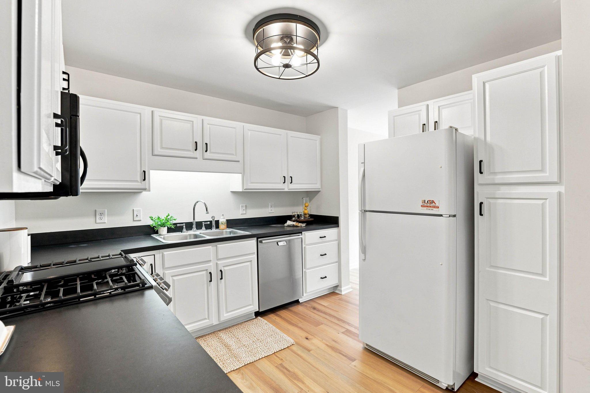 366 Crosswinds Drive Lititz, PA 17543 - Photo 7 of 35 Modern kitchen with sleek white cabinetry.