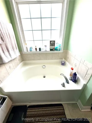 a view of swimming pool with seating area and trees