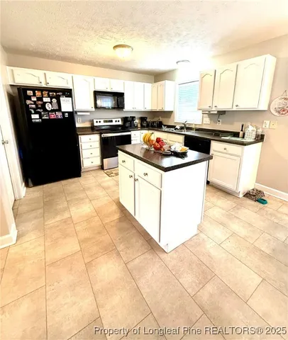 a living room with a piano and furniture