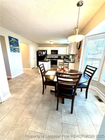a view of a livingroom with furniture and window