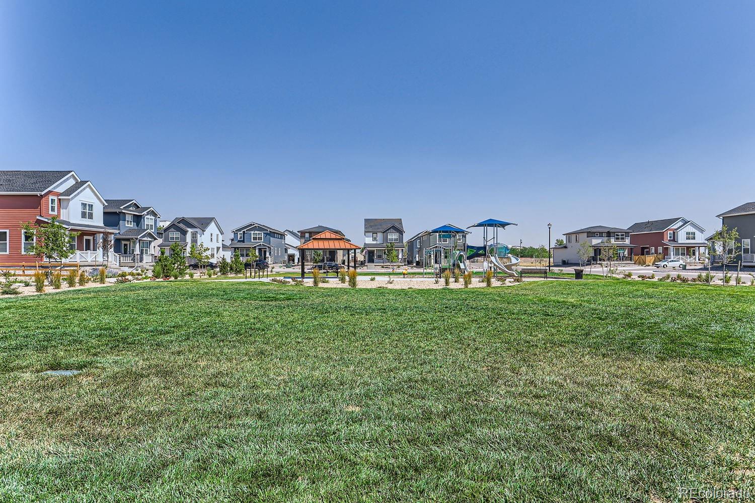 640 Aspen Avenue Bennett, CO 80102 - Photo 11 of 16 a view of a house with garden space and a car parked in the background
