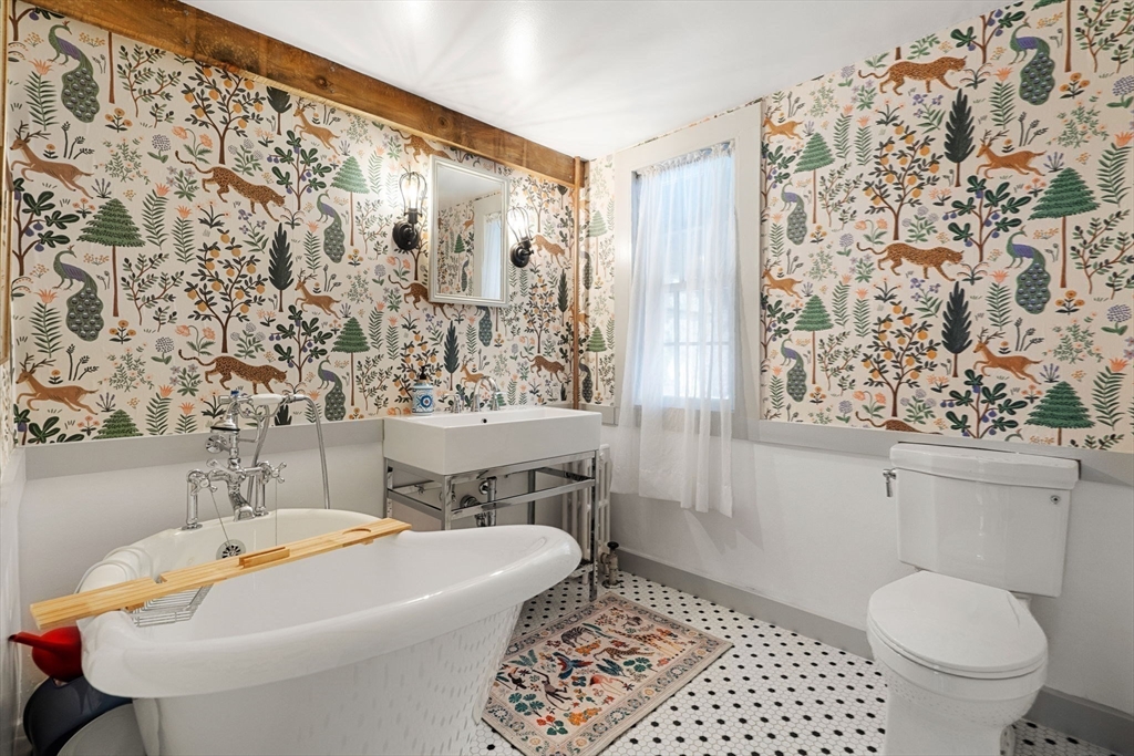 161 Spofford Road Boxford, MA 01921 - Photo 13 of 30 a bath room with a toilet and a shower curtain