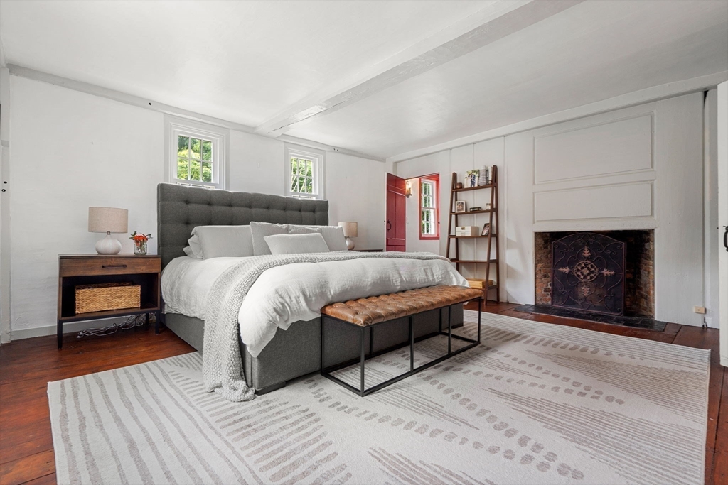 161 Spofford Road Boxford, MA 01921 - Photo 19 of 30 a bedroom with a bed and a fireplace