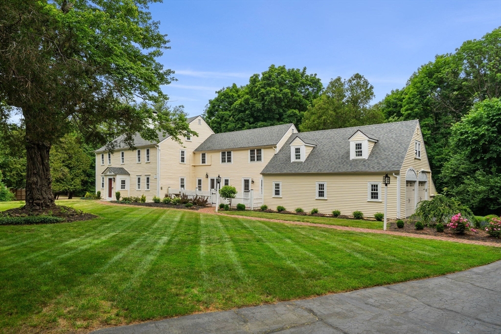 161 Spofford Road Boxford, MA 01921 - Photo 2 of 30 a front view of a house with a garden