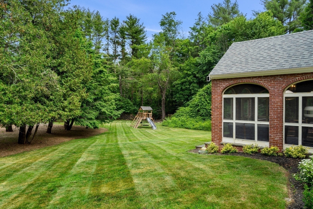 161 Spofford Road Boxford, MA 01921 - Photo 27 of 30 a view of an house with backyard space and garden
