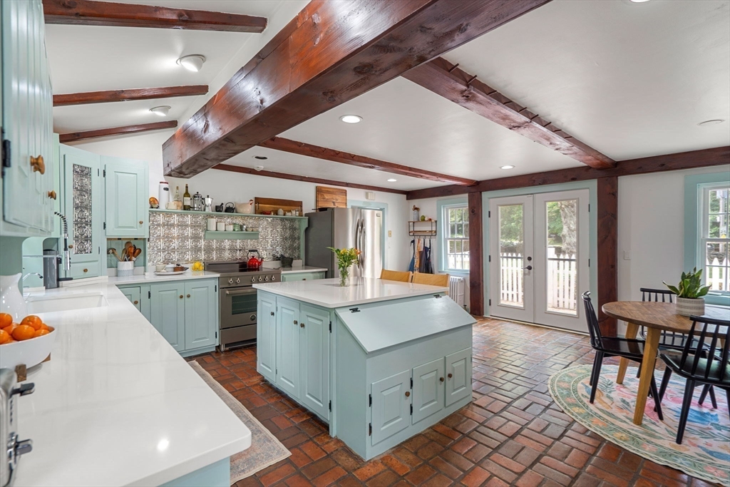161 Spofford Road Boxford, MA 01921 - Photo 6 of 30 a view of living room with granite countertop furniture and a fireplace